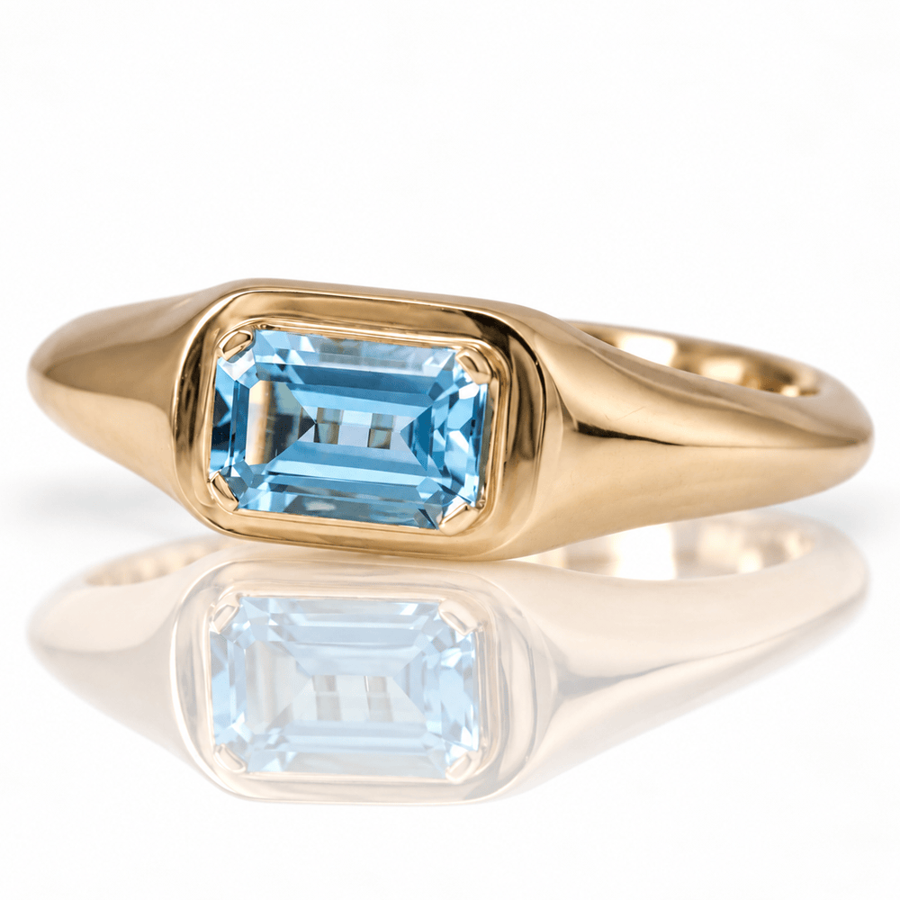 10K Yellow Gold Emerald-Cut Blue Topaz Solitaire Ring
Gold & Silver Pawn Shop