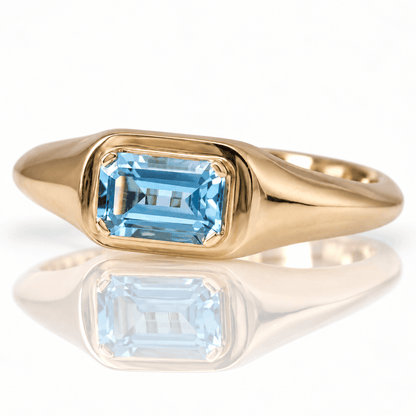 10K Yellow Gold Emerald-Cut Blue Topaz Solitaire Ring
Gold & Silver Pawn Shop