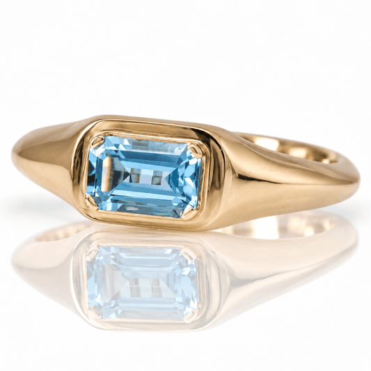 10K Yellow Gold Emerald-Cut Blue Topaz Solitaire Ring
Gold & Silver Pawn Shop