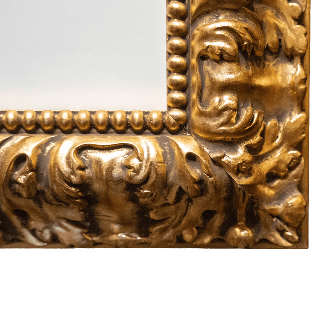 Detailed view of bottom right corner of ornate gold frame