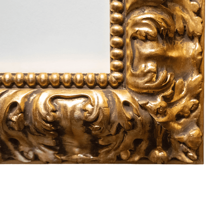 Detailed view of bottom right corner of ornate gold frame