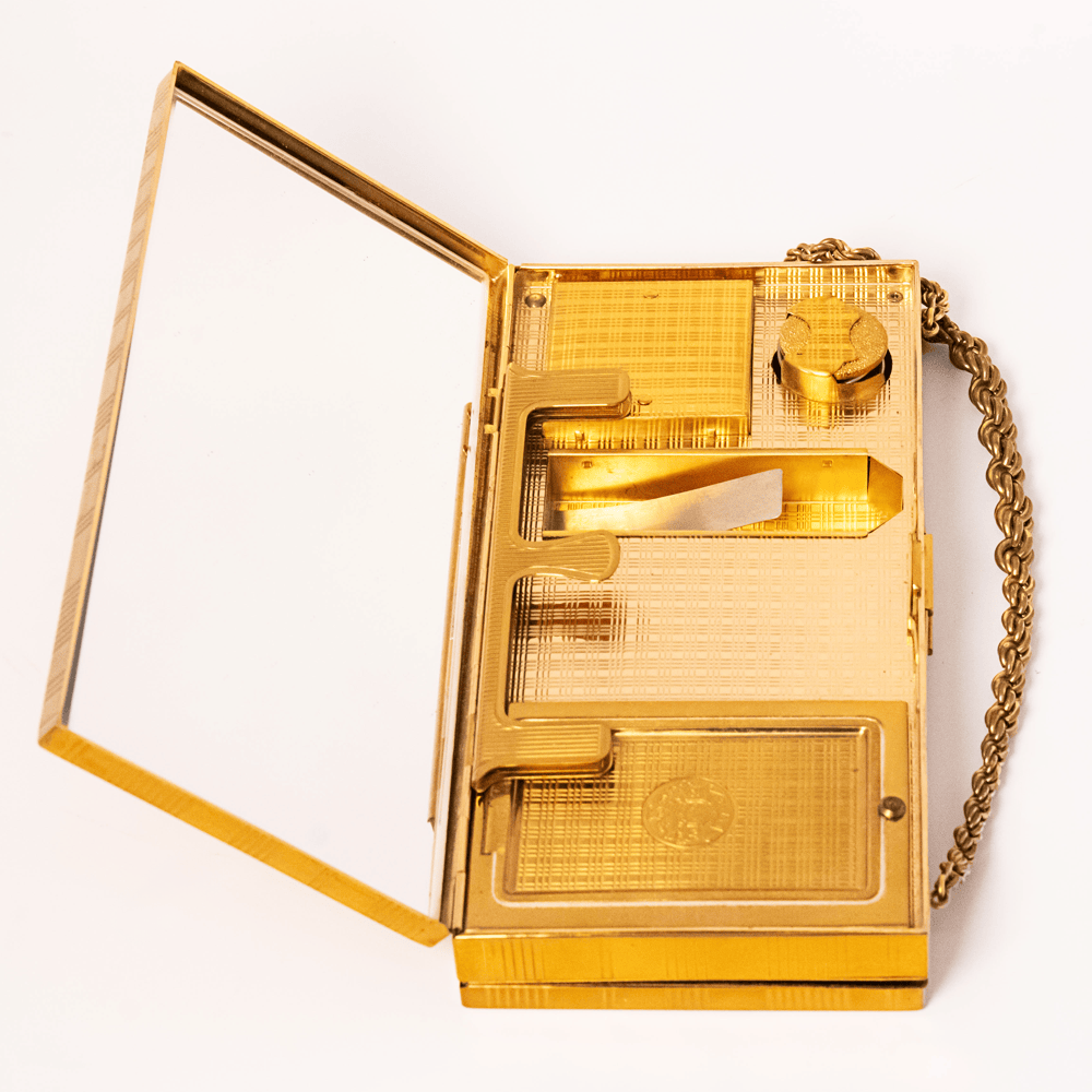 Vintage Evans Gold-Tone Cigarette & Makeup Compact Case
Gold & Silver Pawn Shop